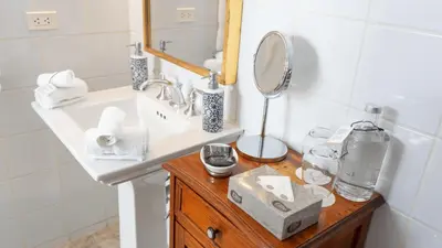 a bathroom with a sink and a mirror at Casa Republica Barranco Boutique Hotel in Lima