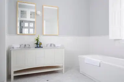 a white bathroom with a tub and a sink at Casa Republica Barranco Boutique Hotel in Lima