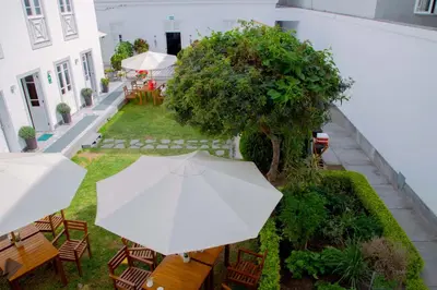 an overhead view of a patio with an umbrella at Casa Republica Barranco Boutique Hotel in Lima