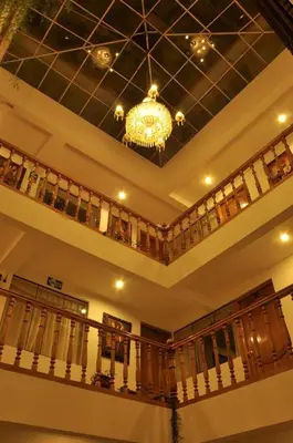 a ceiling with a chandelier in a room at Awki´s Dream Hotel in Cusco
