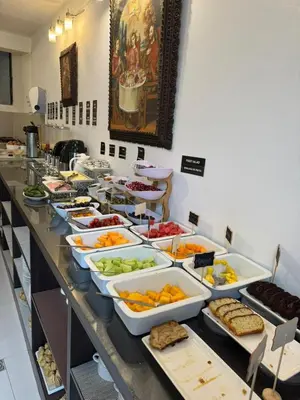 a buffet line with many different types of food at Awki´s Dream Hotel in Cusco