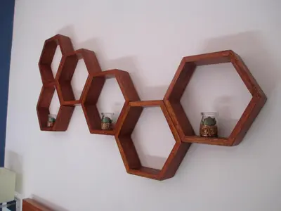a pair of wooden mirrors hanging on a wall at Quinua Boutique Apartments in Cusco