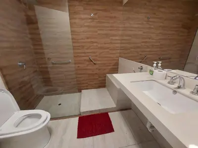 a bathroom with a toilet and a sink and a shower at Apartamento PARDO CCA in Lima