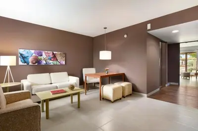 a living room with a couch and a table at The Legend Paracas Resort, a Destination by Hyatt Hotel in Paracas