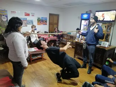 a group of people playing a video game at Gringo's Wasi in Cusco