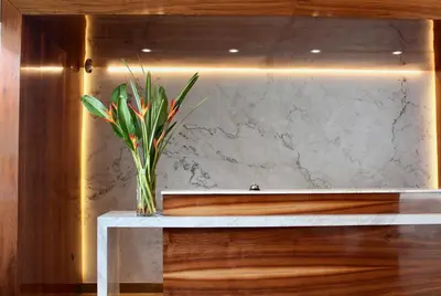 a vase with a plant sitting on a table at Habitat Hotel in Lima