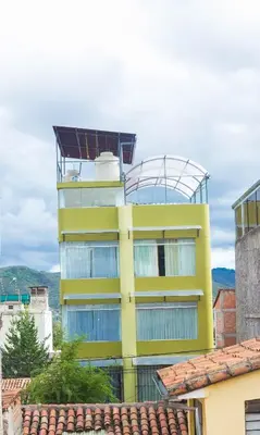 a yellow building with a dome on top of it at Boutique Amaru Wasi in Cusco