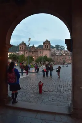 a group of people walking in front of a building at Boutique Amaru Wasi in Cusco