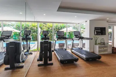 a gym with a bunch of treadmills in a room at Country Club Lima Hotel – The Leading Hotels of the World in Lima