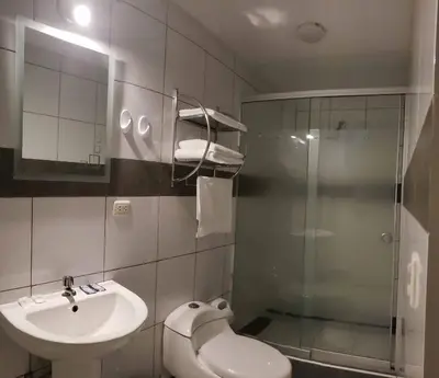 a bathroom with a toilet and a sink and a shower at Mantu Boutique in Machu Picchu