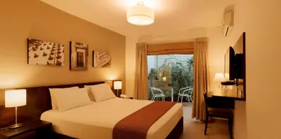 a hotel room with a bed and a window at Girasoles Hotel in Lima