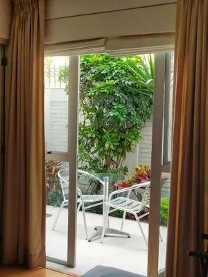 a view of a balcony with a table and chairs at Girasoles Hotel in Lima