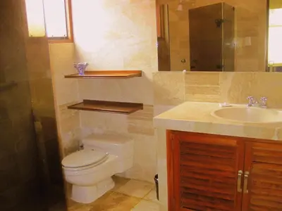 a bathroom with a toilet and a sink at Peru Star Apart-Hotel in Lima