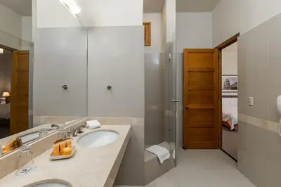 a bathroom with a sink and a mirror at LP Los Portales Hotel Tarma in Tarma