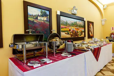 a buffet table with food on top of it at LP Los Portales Hotel Tarma in Tarma