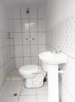 a bathroom with a toilet and a sink at Hostal sambleño cusco Piero suite in Cusco