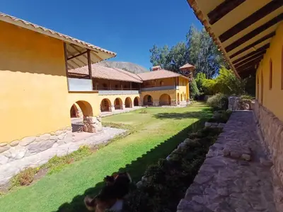 an exterior view of a house with a yard at Willka Rumi in Urubamba