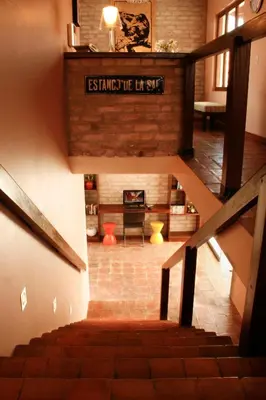 an overhead view of a staircase in a house at Kutty Wasi in Cusco