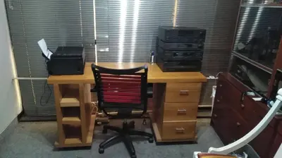 an office with a desk with a printer and a chair at Main Square in Lima