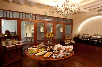 a large room with a table with fruit on it at Aranwa Cusco Boutique Hotel in Cusco