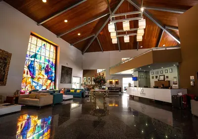a large room with a large stained glass window at Aranwa Sacred Valley Hotel & Wellness in Urubamba