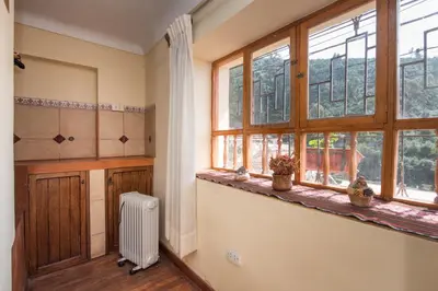 a room with a window and a radiator in a room at Ayenda Casa Escondida San Cristóbal Premium in Cusco