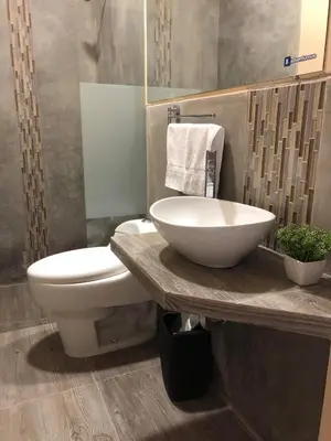 a bathroom with a sink and a toilet at Paracas Guest House in Paracas