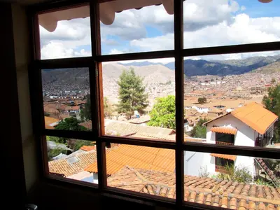 a view through a window of a city at Best View apartment downtown Cusco in Cusco