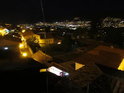 a view of a city at night with lights at Best View apartment downtown Cusco in Cusco
