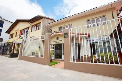 a building with a fence in front of it at Hostal Danna Inn in Cusco