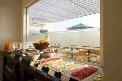 a buffet with different types of food on a counter at Tierra Viva Miraflores Mendiburu in Lima