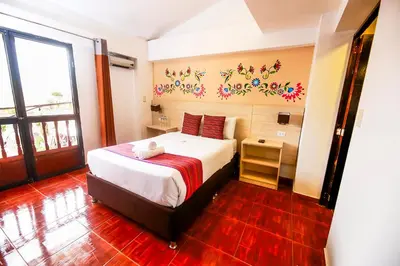 a bedroom with a large bed in a room at Mayu Boutique Hotel in Cusco