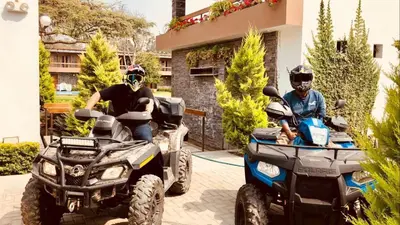 two men on atvs and a man on a quad bike at Hotel Campo & Leña in Cieneguilla