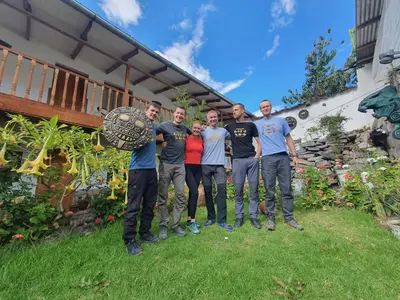 a group of men standing in front of a house at Casona Mollepata in Mollepata