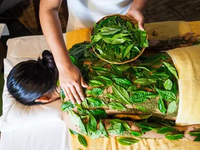 a woman is standing next to a bag of spinach at Inkaterra Machu Picchu Pueblo Hotel in Machu Picchu