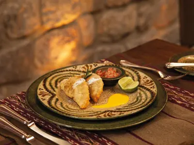 a plate of food on a table with food on it at Inkaterra La Casona Relais & Chateaux in Cusco