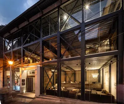 an office building with large windows at night at El MaPi by Inkaterra in Machu Picchu