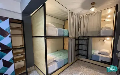 a couple of bunk beds in a room at Supertramp Hostel Machupicchu in Machu Picchu
