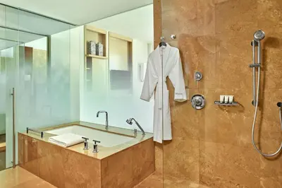 a bathroom with a bath tub and a shower at The Westin Lima Hotel & Convention Center in Lima