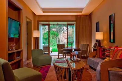 a living room with a couch and a table at Tambo del Inka, a Luxury Collection Resort & Spa, Valle Sagrado in Urubamba