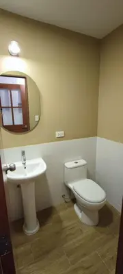 a bathroom with a toilet and a sink at Flying Dog Hostel Cusco in Cusco