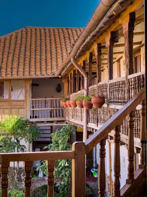 a house with potted plants on the balconies at El Balcón in Cusco