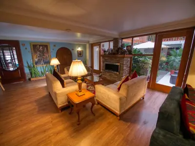 a living room with two couches and a fireplace at Sol Ollantay Boutique Hotel in Ollantaytambo