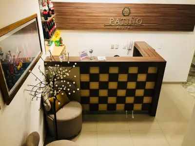 a room with a checkerboard desk and a chair at Hostal Patiño in Lima