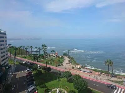an aerial view of a street and the ocean at Malecón in Lima