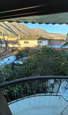 a view of a balcony with mountains in the background at Hotel Quilla in Urubamba