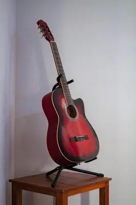 a guitar on a stand on top of a table at Great Partners hostel in Lima