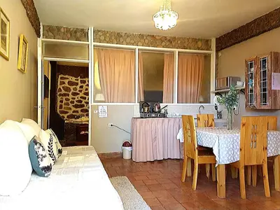 a kitchen with a table and a table and chairs at Cities of the World - Apartments Cusco in Cusco