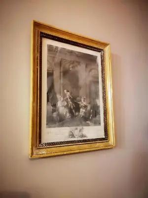 a framed picture of a painting on a wall at Cities of the World - Apartments Cusco in Cusco