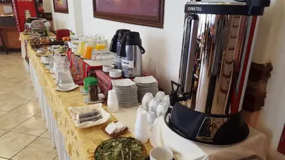 a counter with a coffee maker on top of it at Hotel Taypikala Machupicchu in Machu Picchu